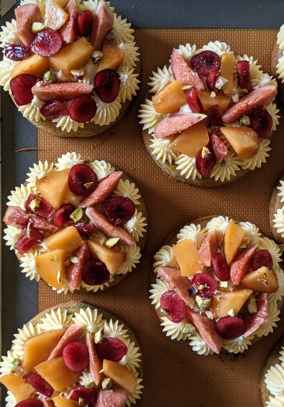 Fresh Organic Fruits Tart with Custard and Pistachio Cake on a Vanilla Biscuit